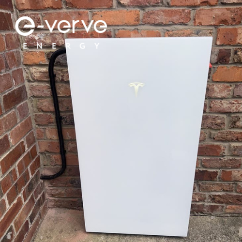 white tesla powerwall 3 solar battery installed in the corner of red brick wall by e-verve energy